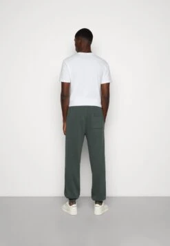 YOURTURN Oversized Unisex - Trainingsbroek -Dark Green -Yourturn 42776076c49c4d49984fa3254d41719b